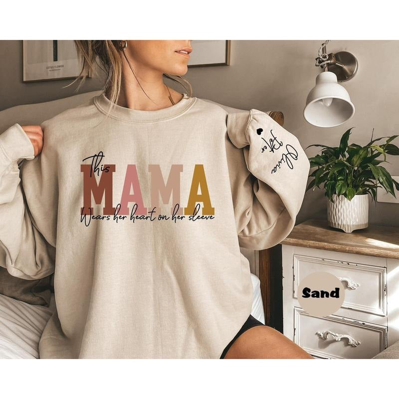 Custom This Mama Wears Her Heart Sleeve Personalized - Adult & Kids T-Shirts, Sweatshirts & Hoodies apparel design preview 1