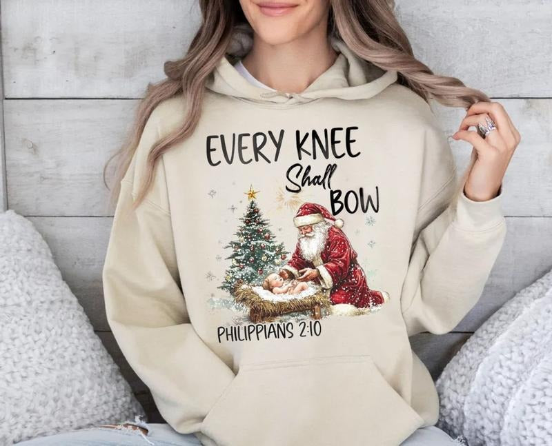 Every Knee Shall Bow Nativity Scene Santa Kneeling - Adult & Kids T-Shirts, Sweatshirts & Hoodies apparel design preview 1