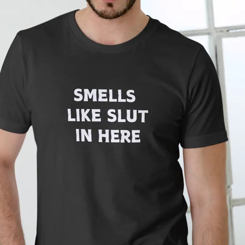 SMELLS HERE Casual Short Sleeve Text Print Black - Adult & Kids T-Shirts, Sweatshirts & Hoodies apparel design preview 1