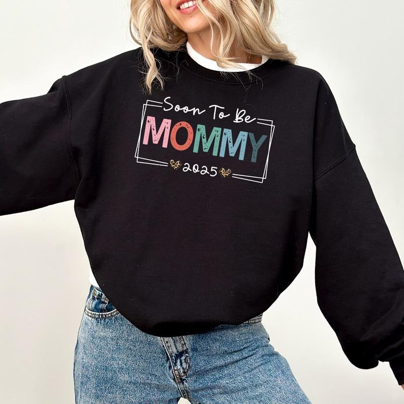Soon Be Mommy 2025 Pregnancy Announcement Sublimation - Adult & Kids T-Shirts, Sweatshirts & Hoodies apparel design preview 1