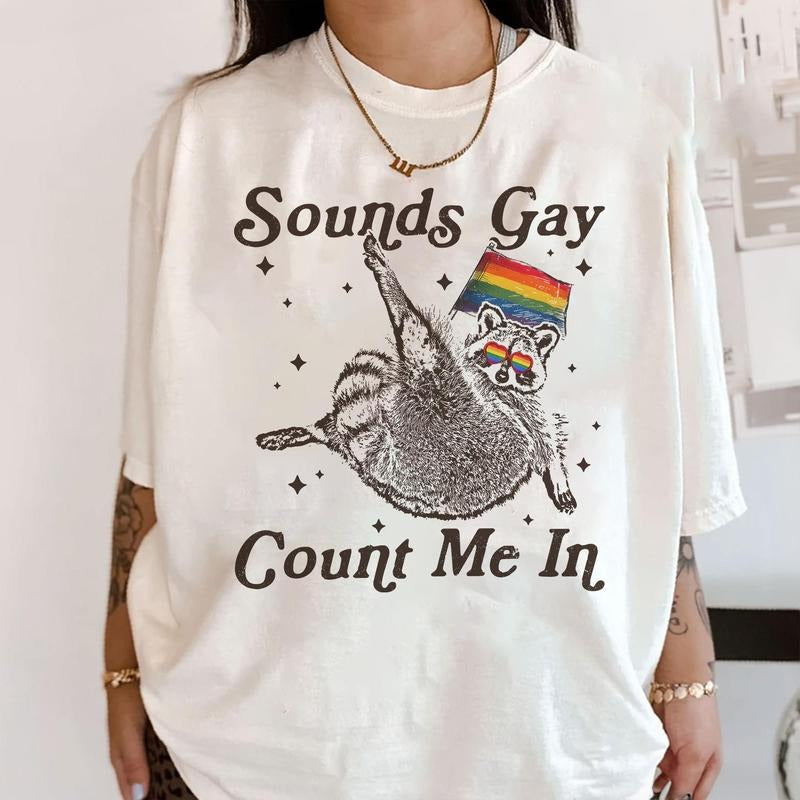 Sounds Gay Count Me Racoon Lgbt Lgbtq+ Community - Adult & Kids T-Shirts, Sweatshirts & Hoodies apparel design preview 1