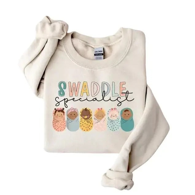 Swaddle Specialist Labor Delivery NICU Nurse Mother - Adult & Kids T-Shirts, Sweatshirts & Hoodies apparel design preview 1